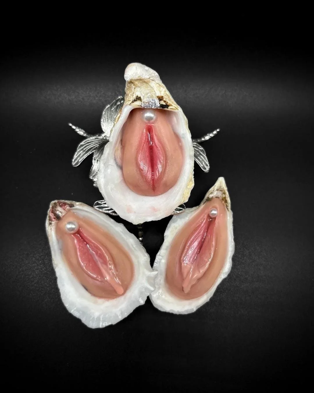 Moister handmade oyster shell oddity sculpture on black background