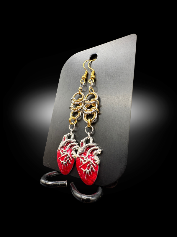 Bleeding Heart earrings close-up showing chainmail links and red heart charm