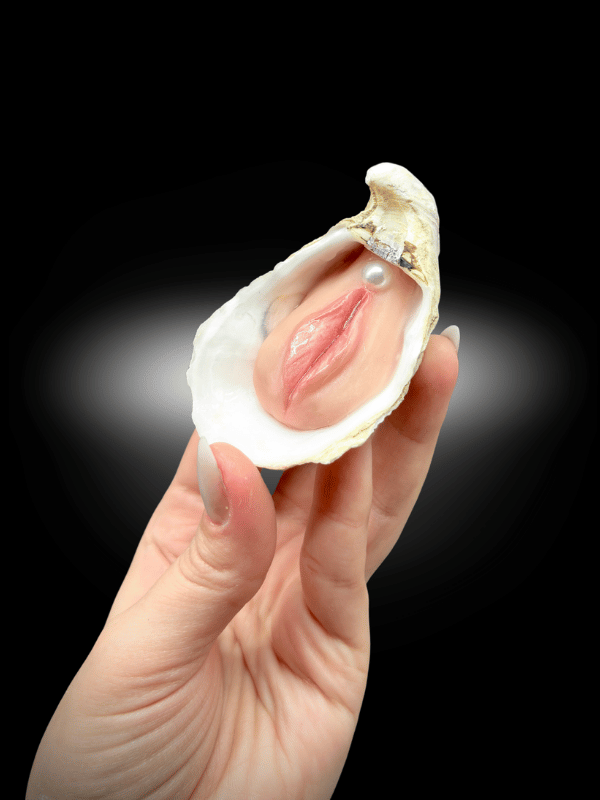 Moister handmade oyster shell oddity sculpture on black background