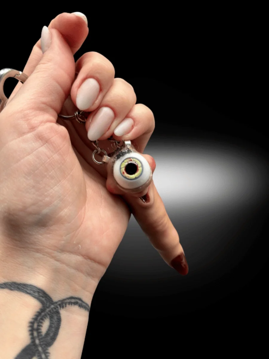 Creepy cute eyeball keychain dangling from chain alternative accessory