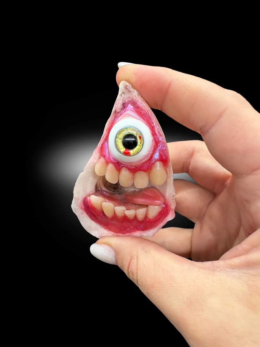 gothic oddity art piece made from real oyster shell with monster face