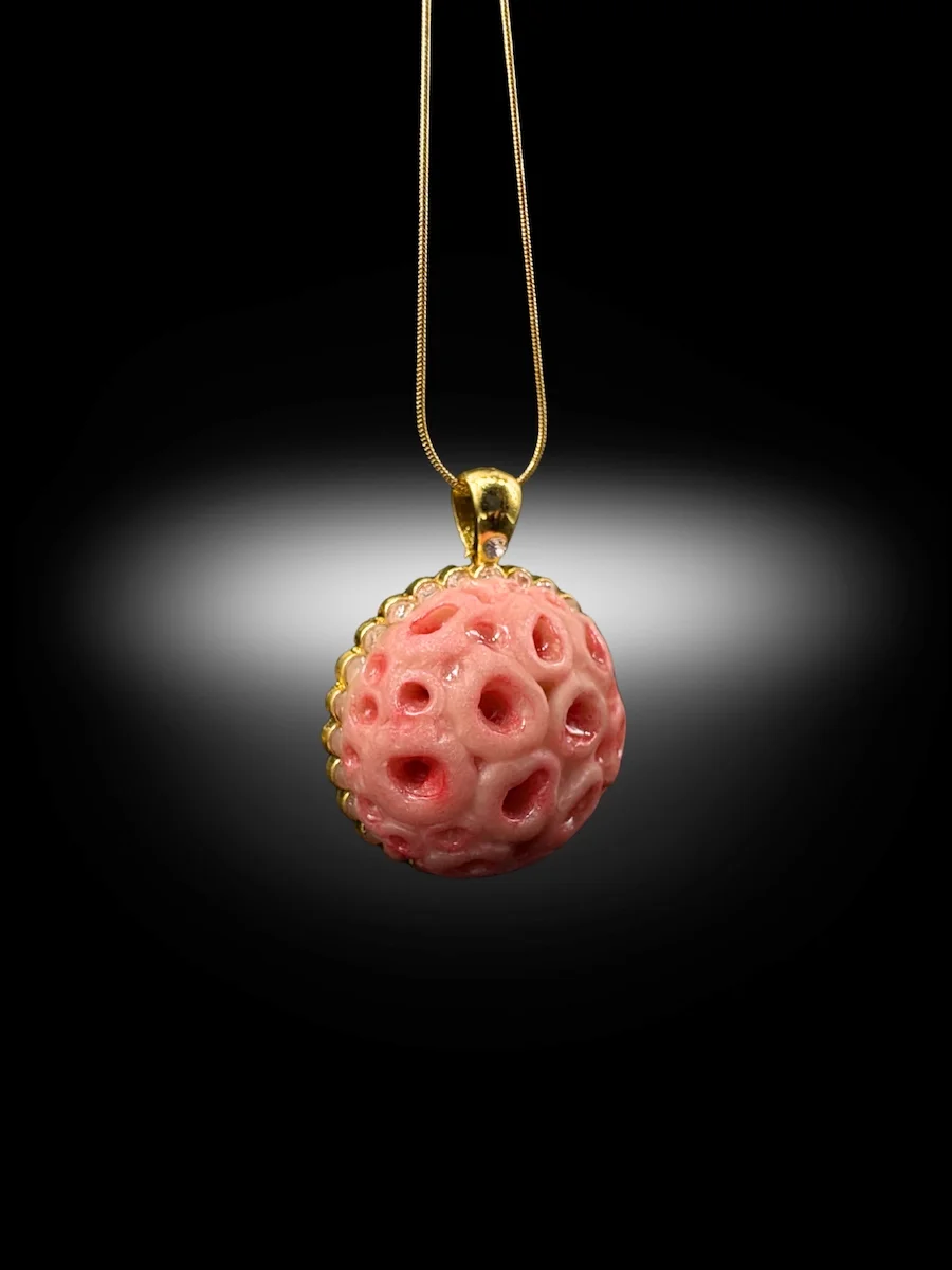 trypophobic inspired pendant with soft organic surface and clustered hole pattern