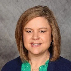 A woman with short straight hair