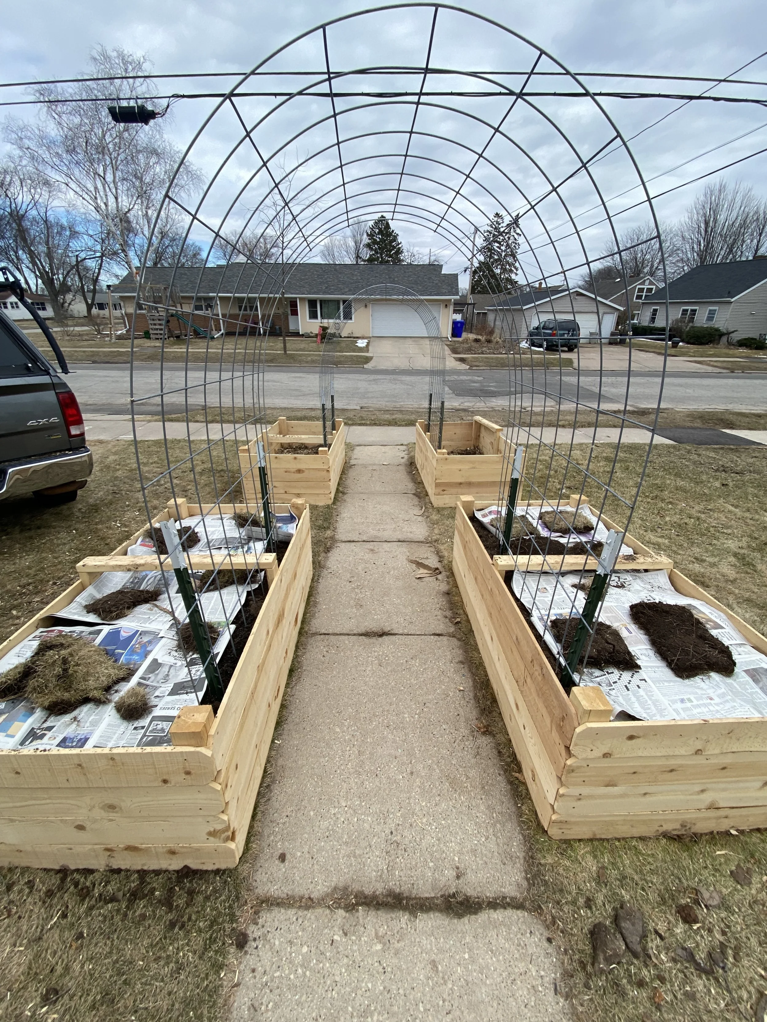 Raised cedar garden beds with trellis