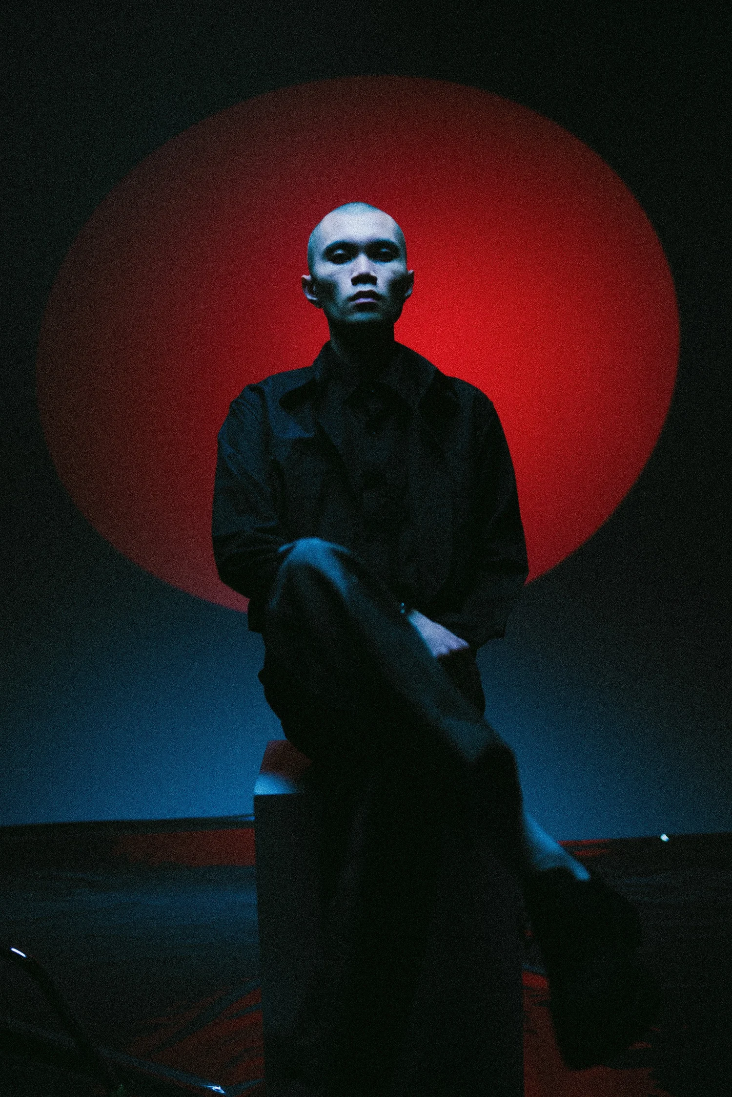 Vertical portrait with red and blue studio lighting
