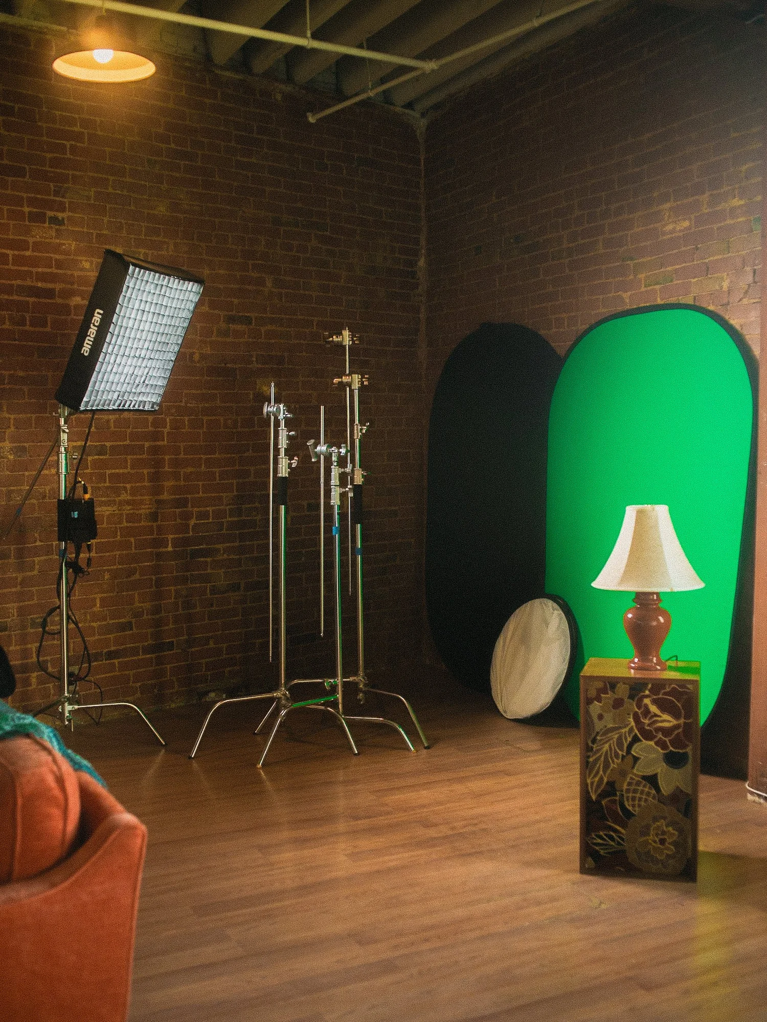 Studio gear corner with stands and collapsible backdrops