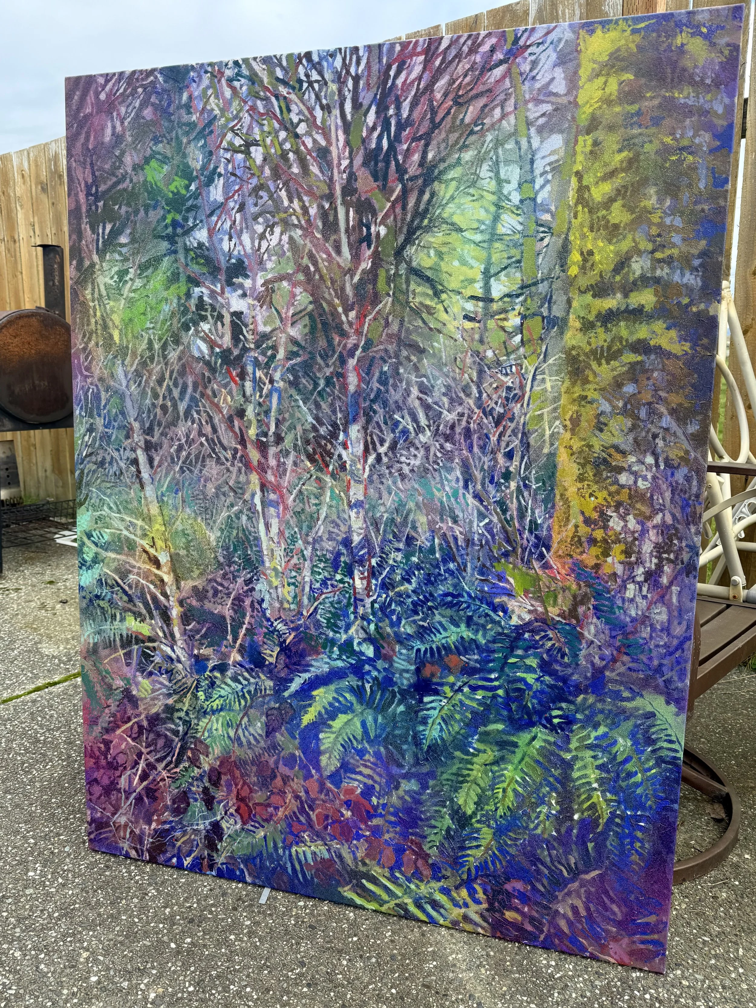 A colorful painting of a dense forest scene, featuring trees, leaves, and foliage with vibrant hues of purple, green, blue, yellow, and red.