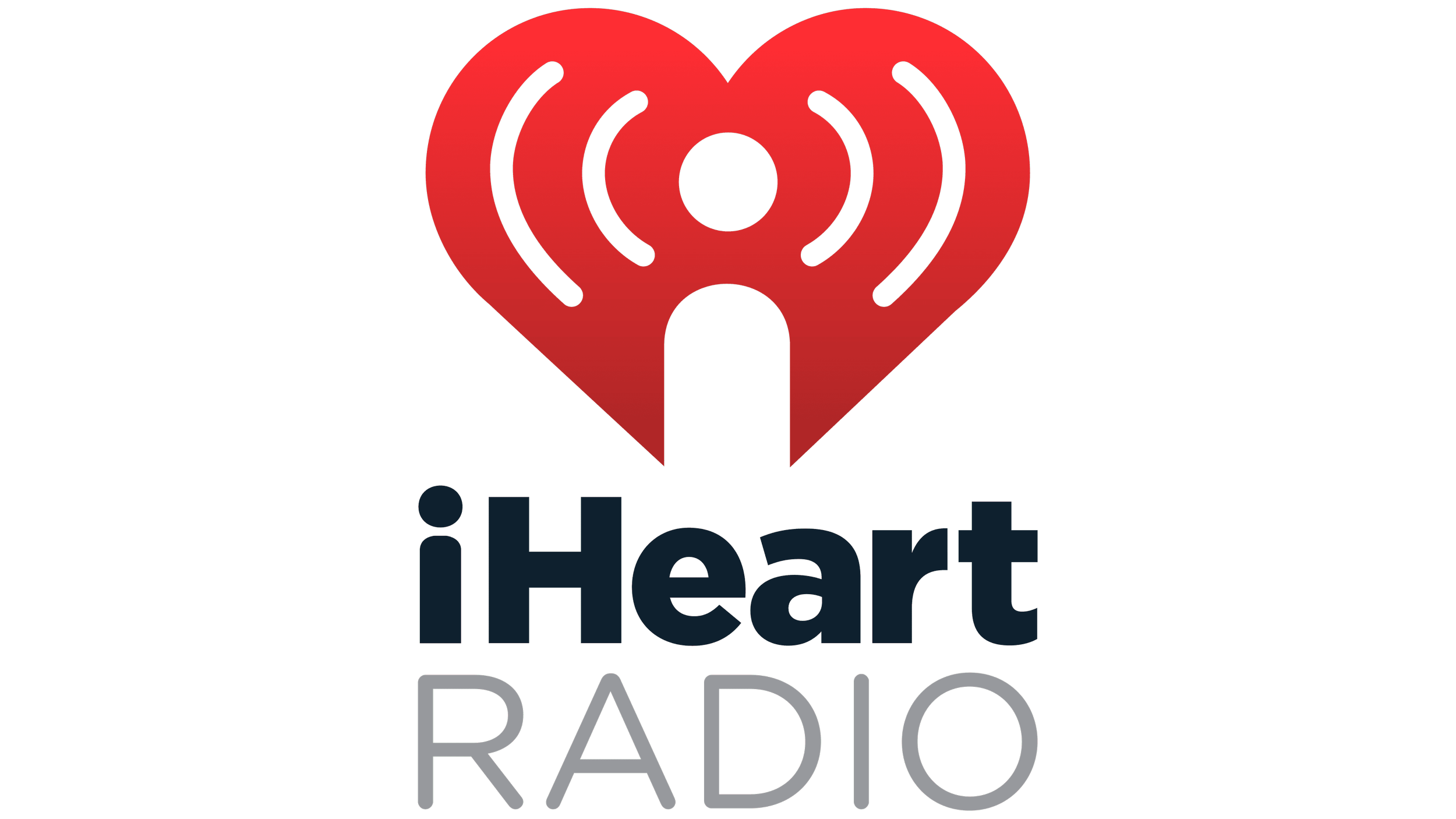 Logo for iHeartRadio featuring a red heart with radio signal lines and the words "iHeart RADIO" in blue and grey text.