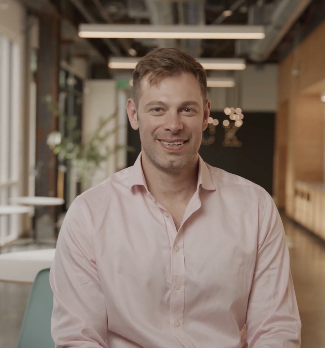 Man smiling at camera from corporate interview for META.