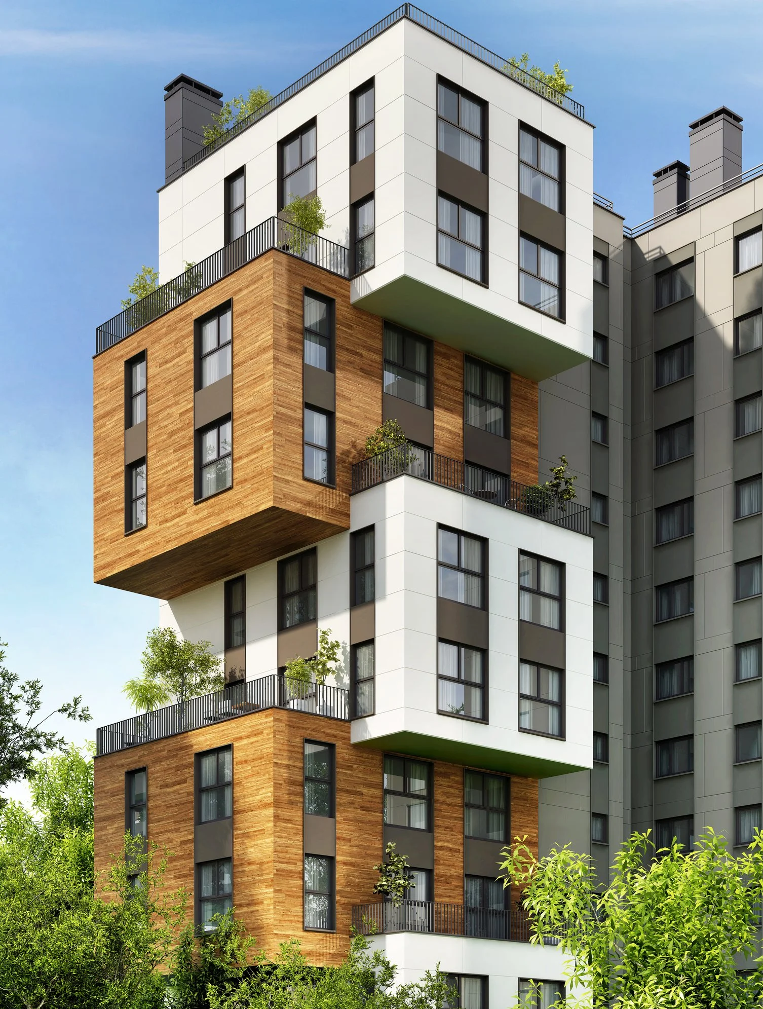 Modern multi-story apartment building with alternating sections of white, gray, and wooden exteriors, featuring balconies with green plants, set against a blue sky and surrounded by greenery.