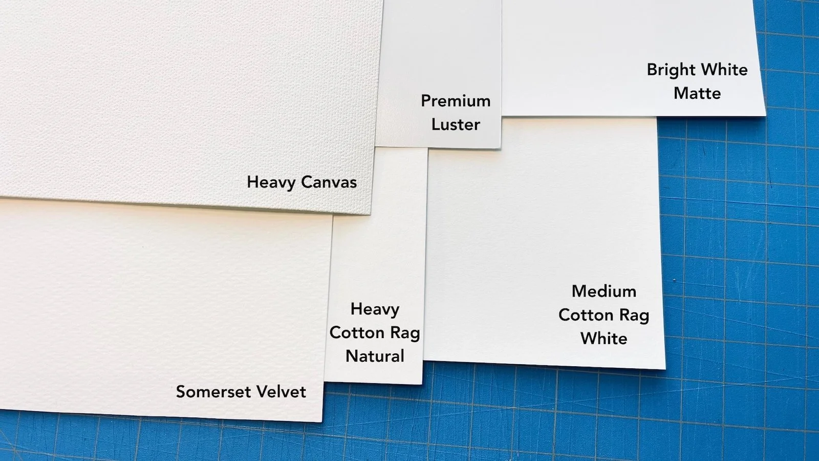 Image showing paper samples: Somerset Velvet, Heavy Matte Canvas, Heavy Cotton Rag Natural, Premium Luster, Bright White Matte, Medium Cotton Rag White.