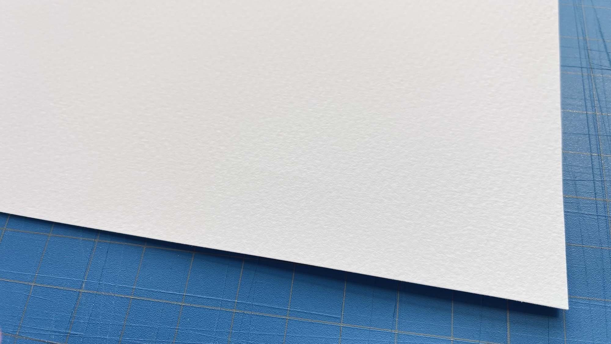 Close-up photo of Somerset Velvet cotton rag paper, showing its richly textured surface. 255 gsm.