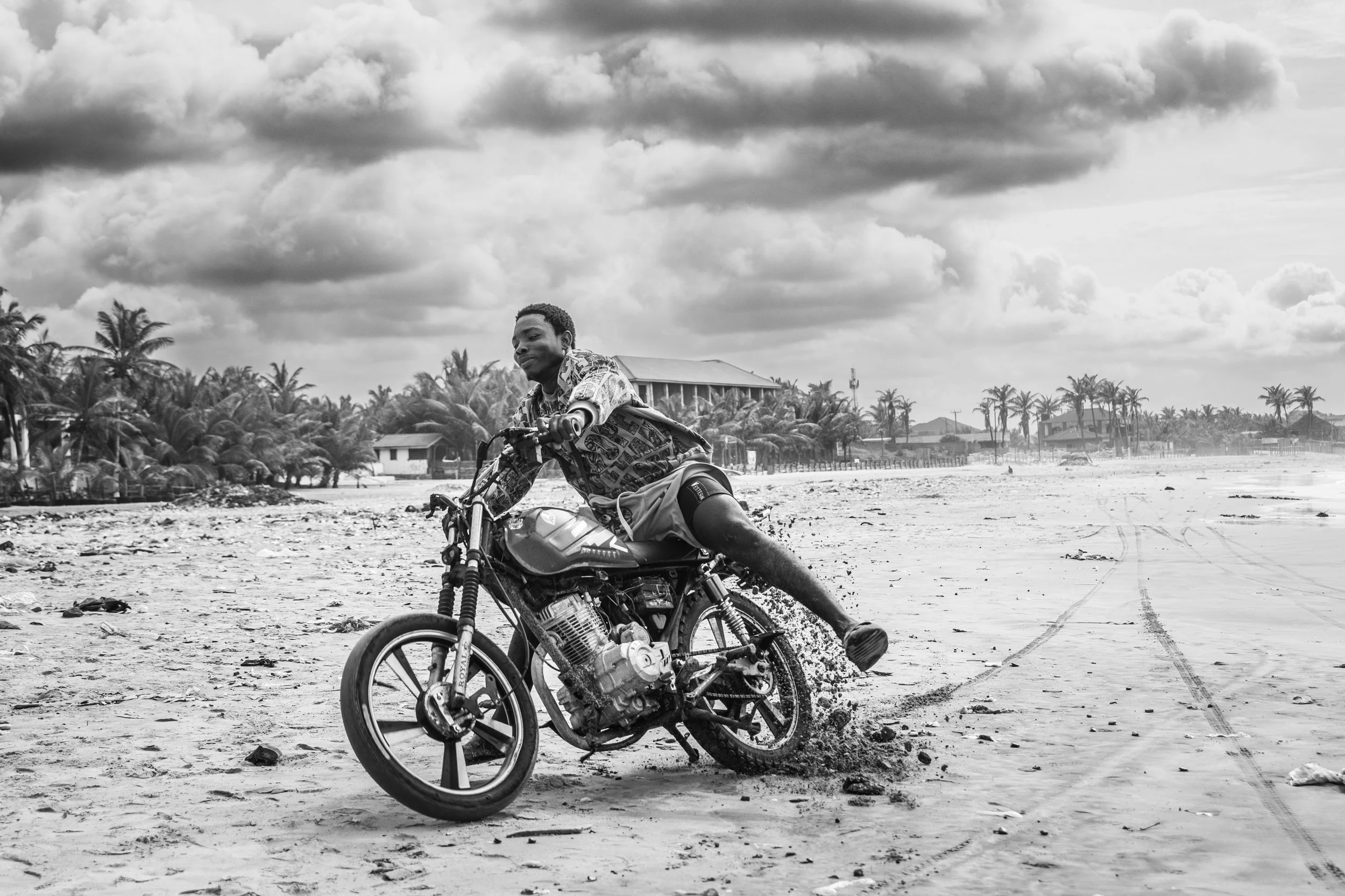 A motorcyclist ripping it down the Teshie beach.