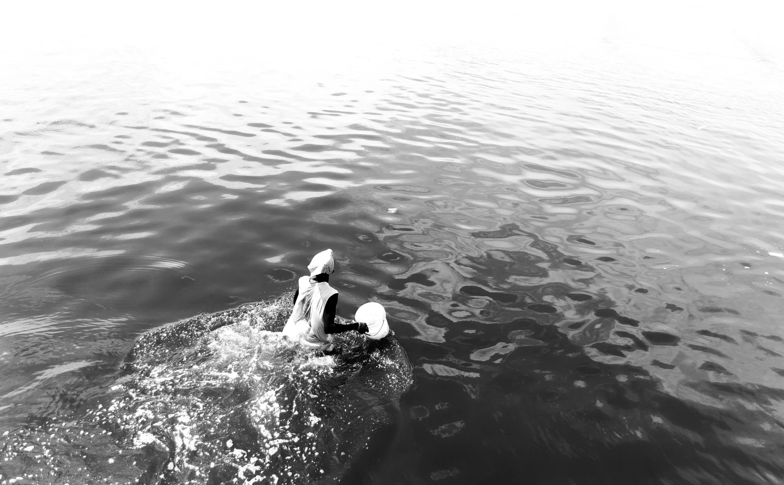 A man fetching water in the Teshie Port.