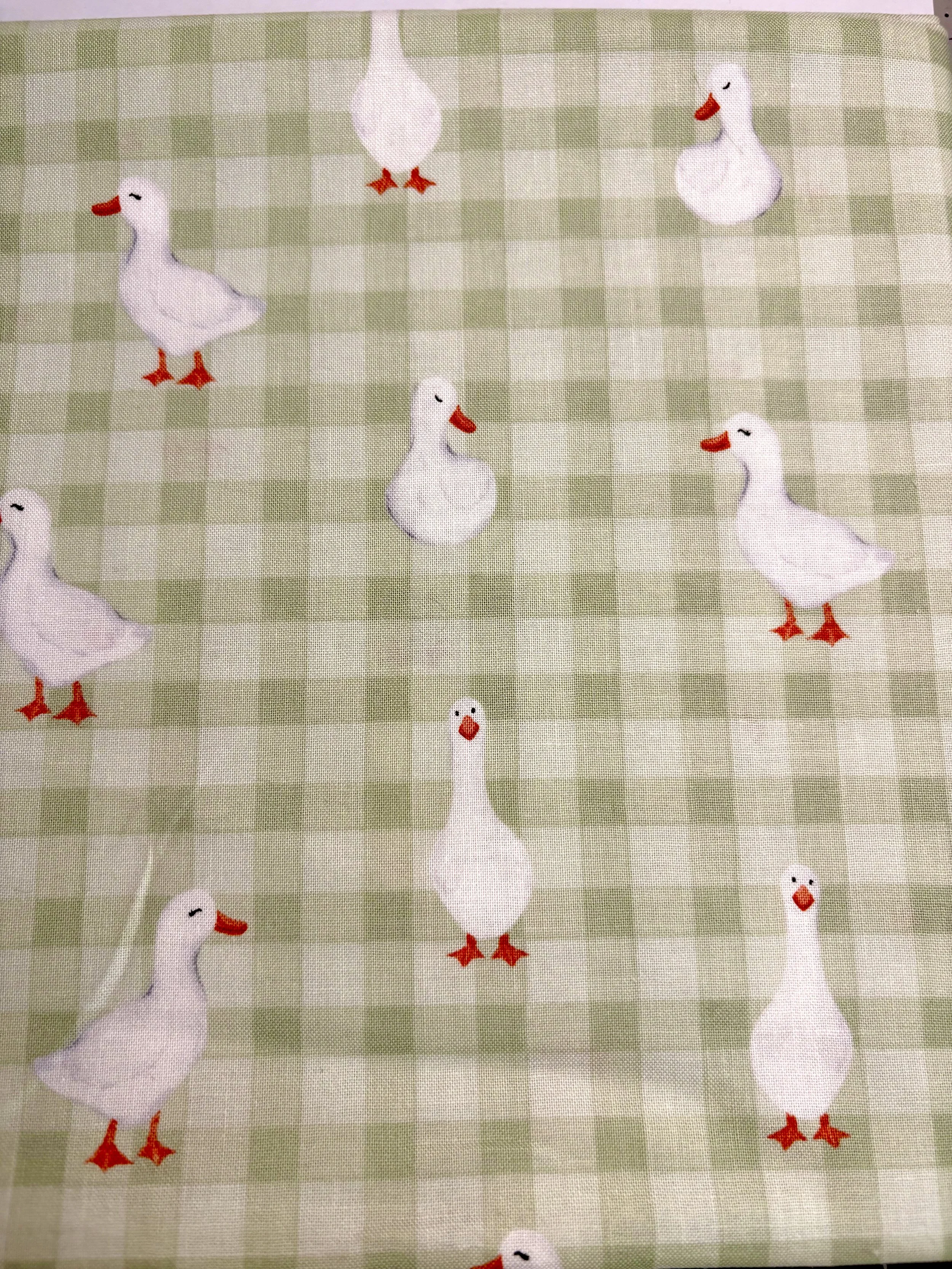 Goose on the loose on green gingham 
