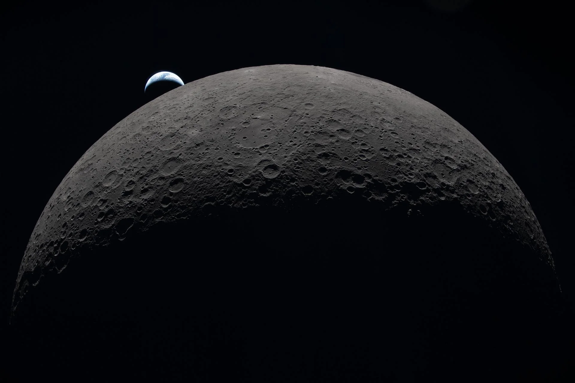 It sounds like a riddle - but a Moon day is the same length as a Moon year. 
Why? The Moon rotates at exactly the rate it orbits Earth - a consequence of the pull of Earth's gravity. 
This is called tidal locking, and explains why we only see one fac
