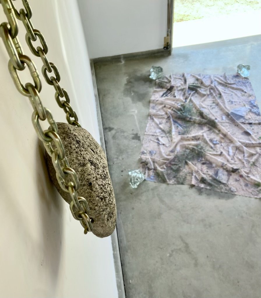 Installation Image of Adrienne's Rock Purse and floor piece.