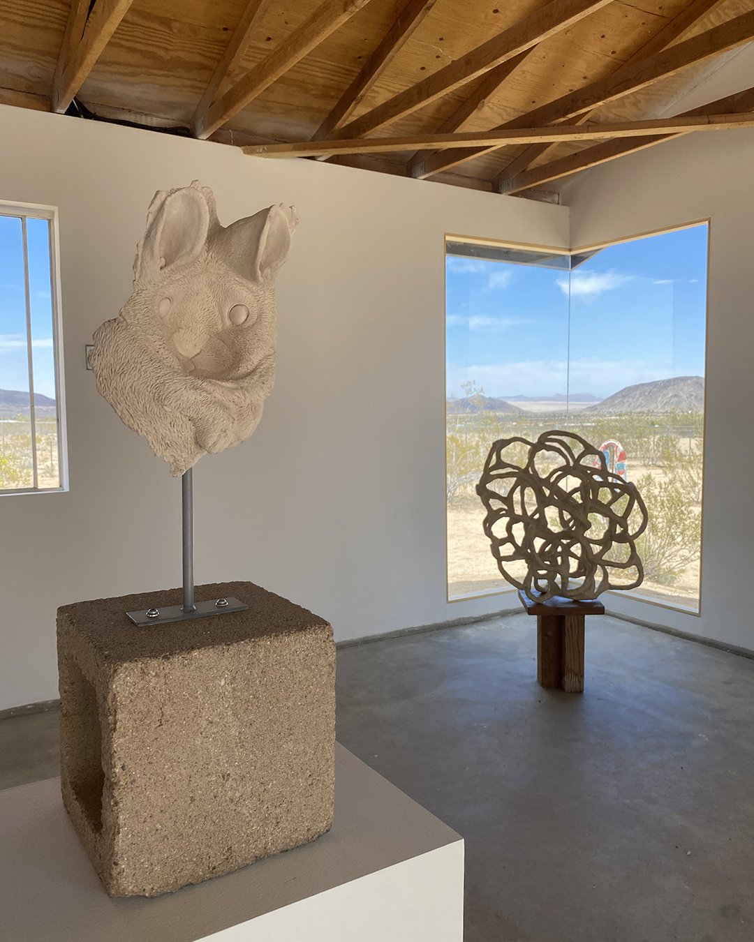 Heidi Schwegler's sculpture is in the front, and Laura Cooper's sculpture is in the back.