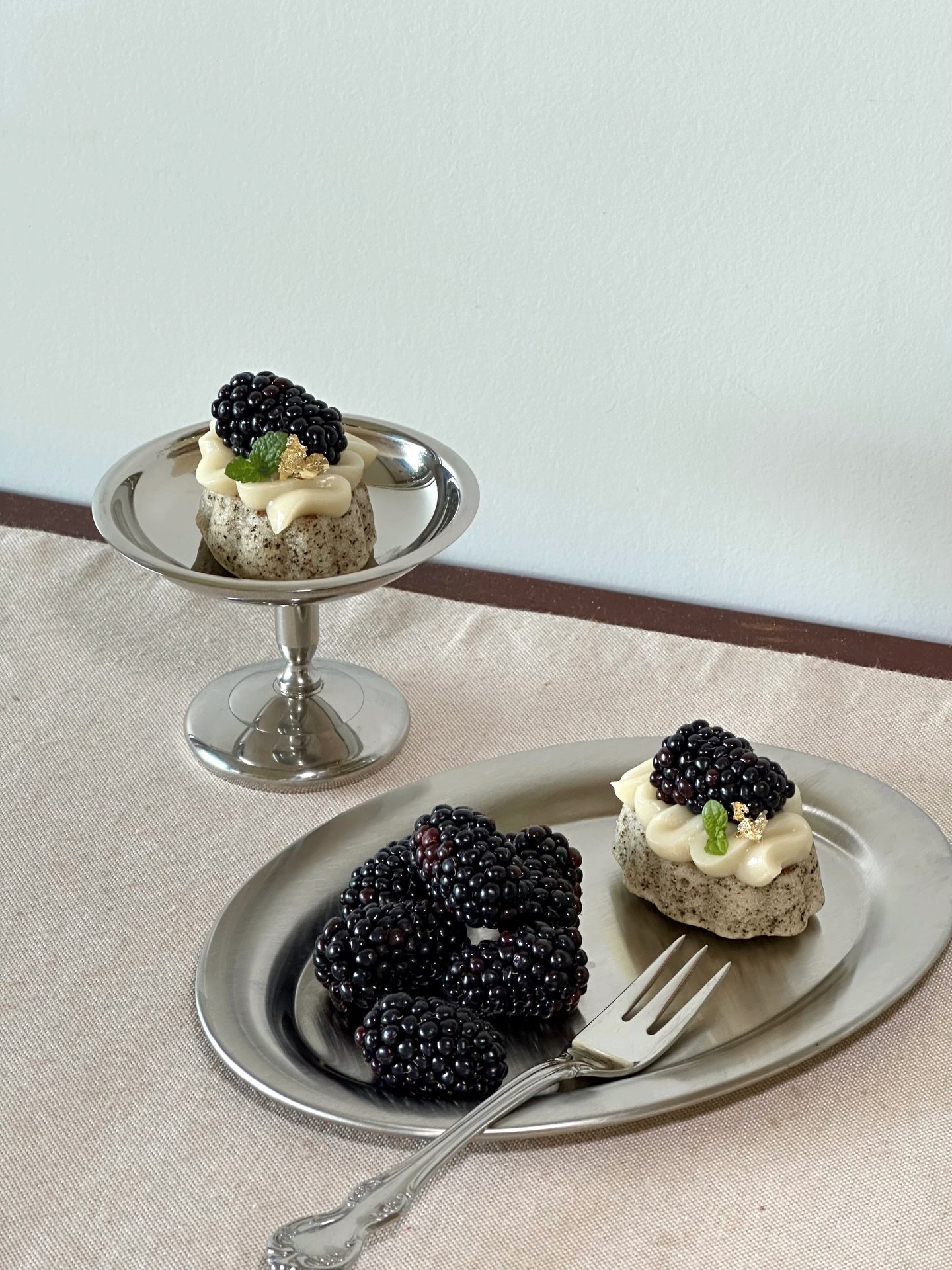 Mini G&acirc;teau

A petite, light dessert we&rsquo;ve been making for summertime.

Black tea almond cake base | dark chocolate ganache layer | oat cr&egrave;me | fresh blackberry