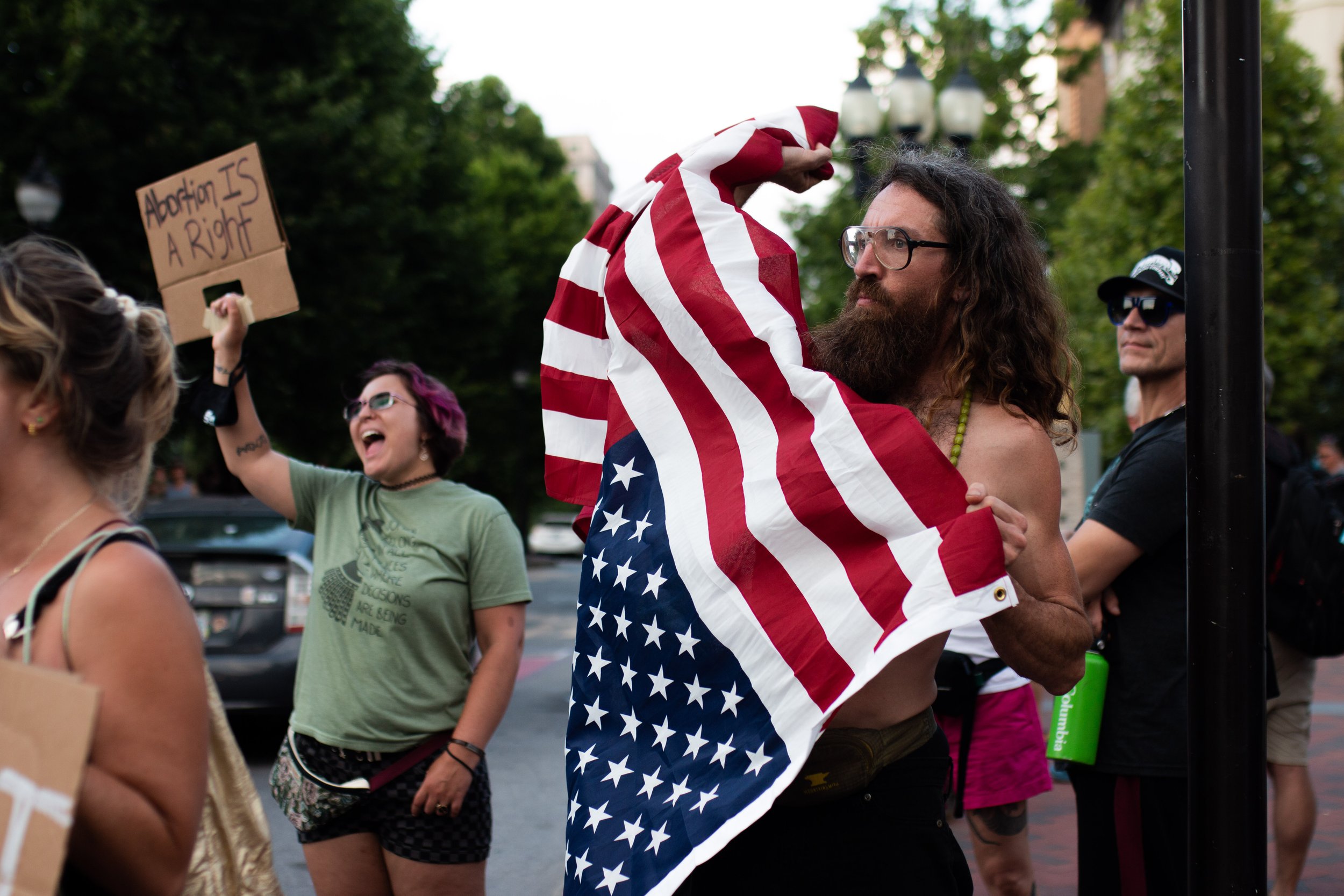 Asheville, North Carolina | June 25, 2022.
Protesters gather in response to the Supreme Court’s decision to overturn Roe v. Wade, voicing outrage, grief, and resistance.