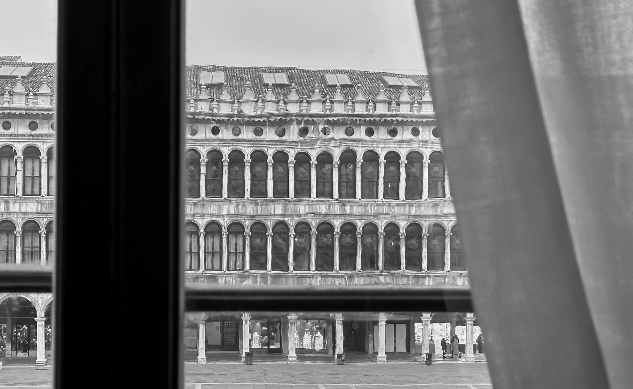 Piazza San Marco, Venice Italy. Procuratie Vecchie building, view from Procuratie Nuove across the piazza. Balck and white art photography.