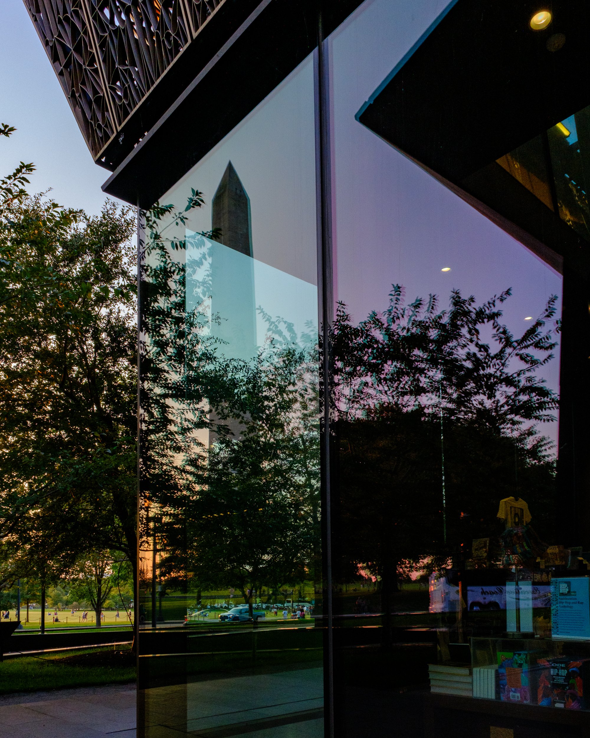 Reflections of opposing landmarks at the Reflections at the Mall, Washington-DC: African American Museum of History and Culture and the Washington Monument. Art Photography.