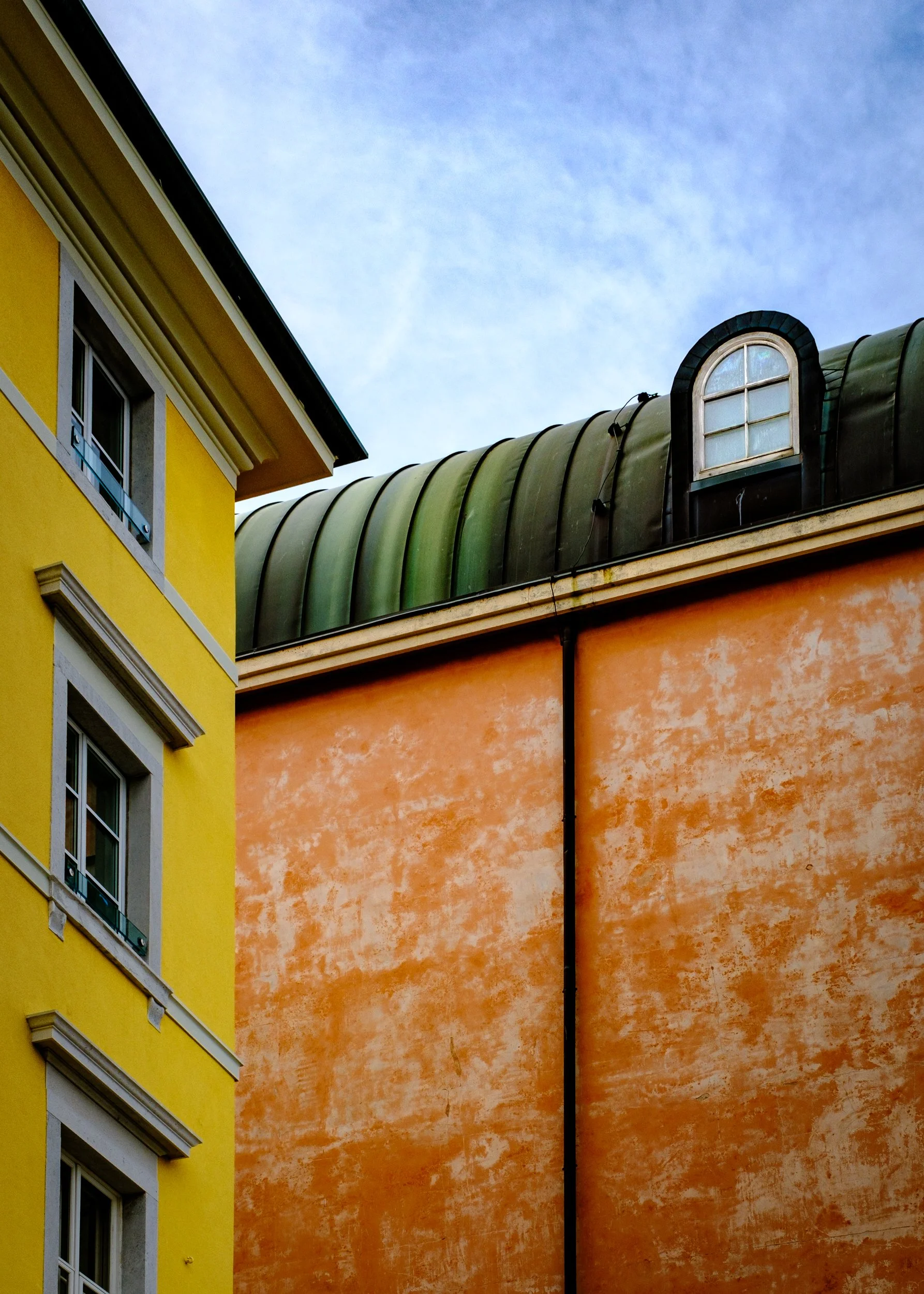 Abstract chromatic composition of intersecting wall planes. Trieste. Italy. Art photography.