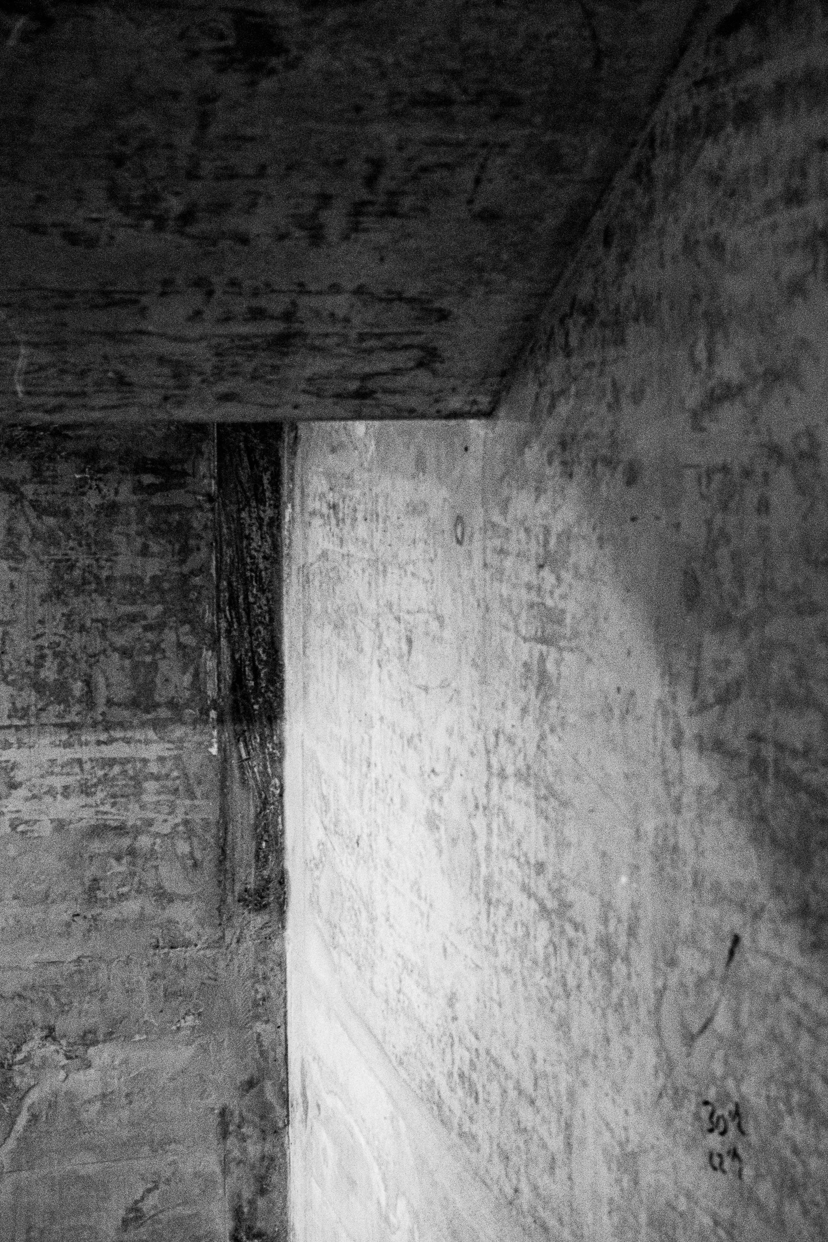 Black and white art photography: light and shadow on raw exposed concrete. 