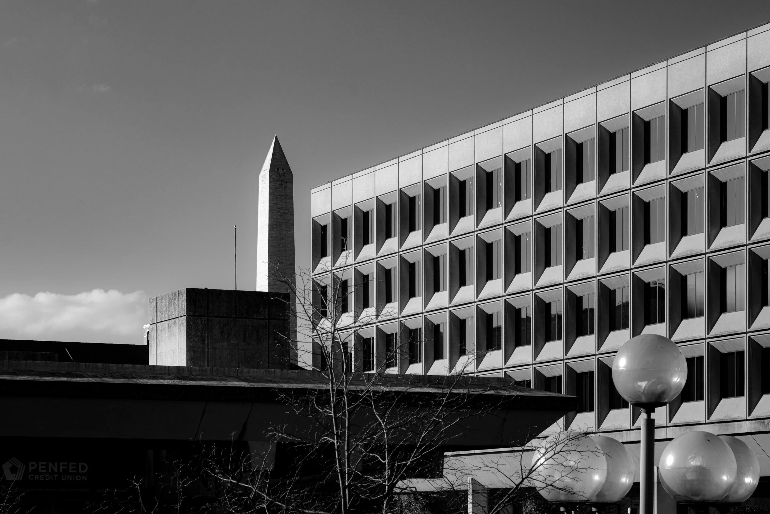 Brutalism and monumentality. Department of  Energy and Washington Monument, Washington DC. Black and white architectural art photography.
