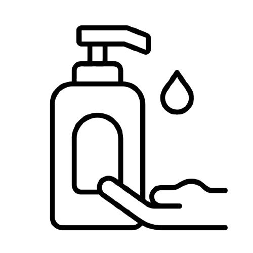 Hand under a liquid soap dispenser with a drop of soap falling into the hand