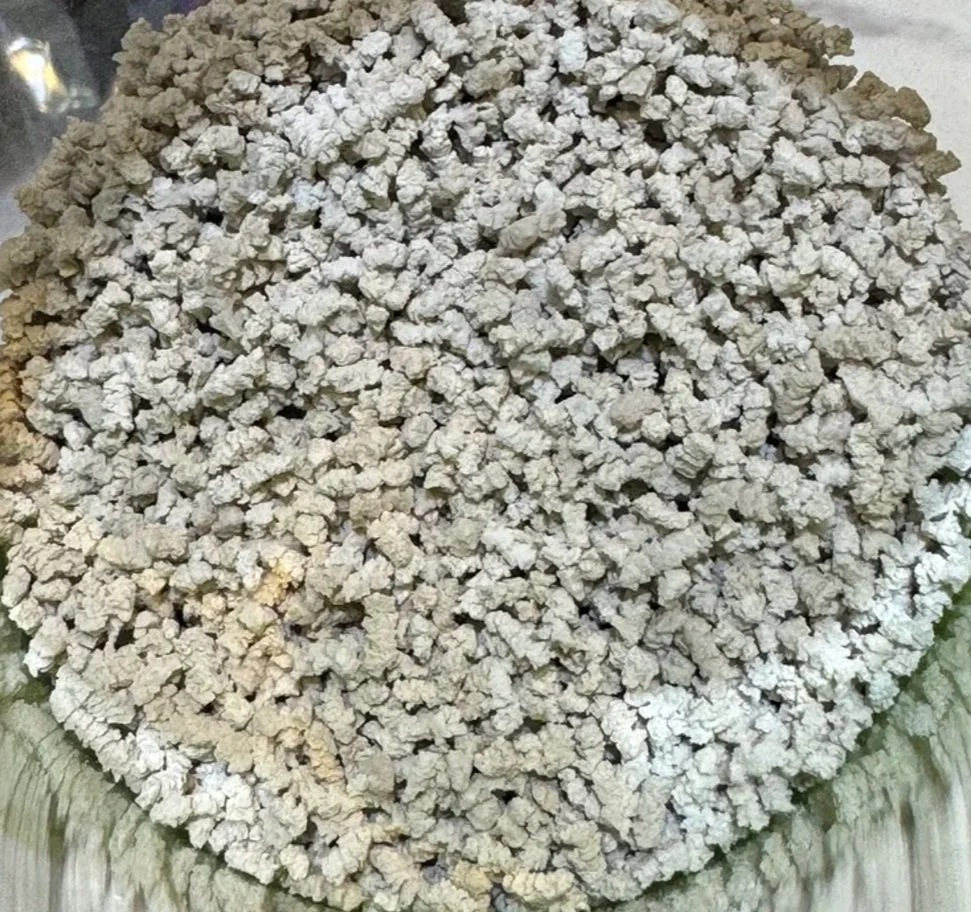 A pile of crumbled tofu on a glass tray.