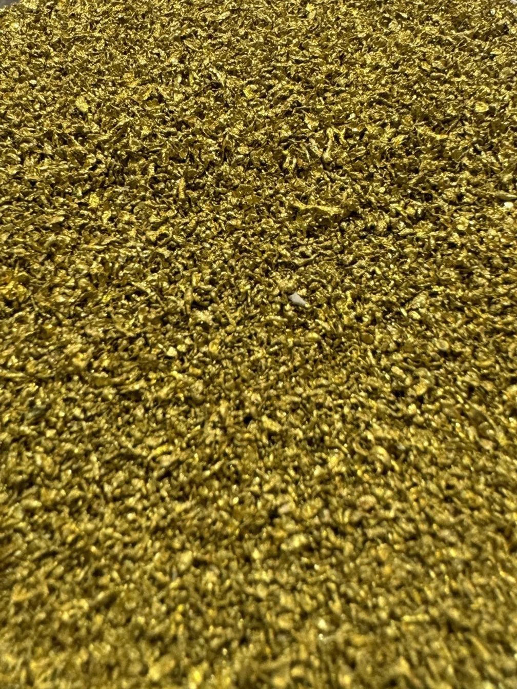 Close-up of a large quantity of KDF-55 copper-zinc alloy