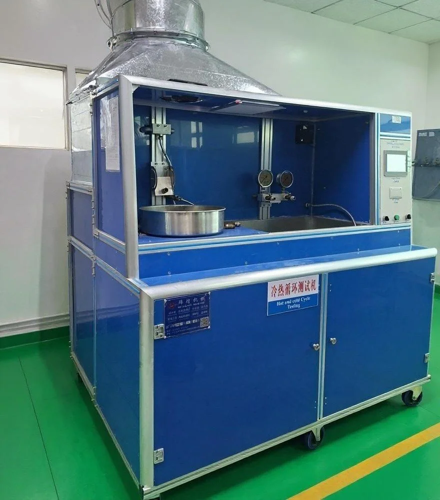 A blue cold and hot stress testing chamber with a metal pan inside, gauges, and control panels, used for testing temperature effects.