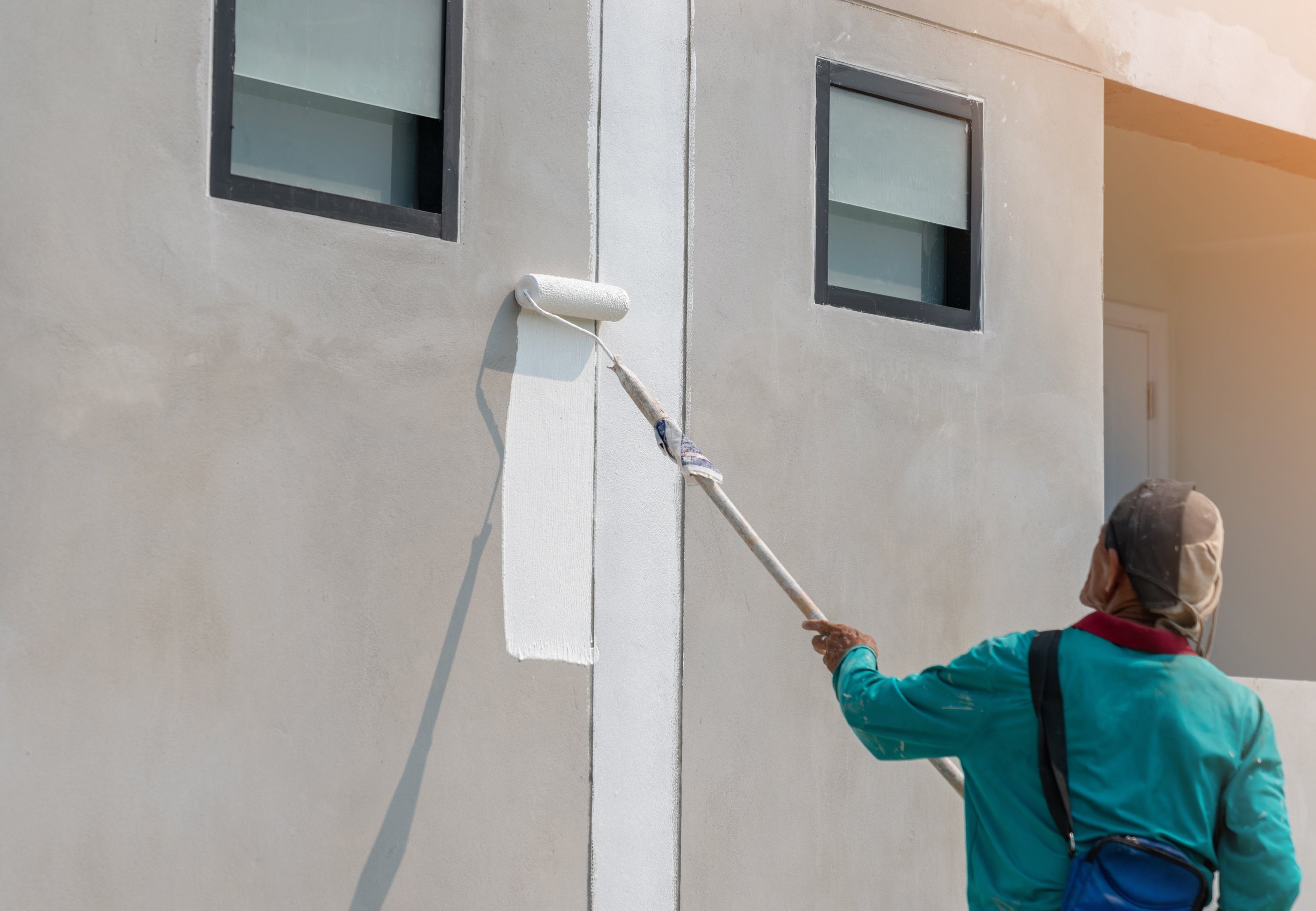 man-paint-white-color-building-wall.jpg