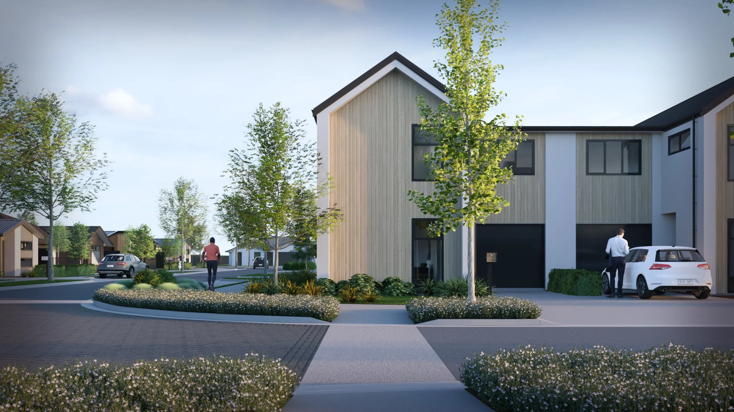 A modern residential neighborhood with a front yard featuring plants and trees, a sidewalk, and houses with cars parked outside.