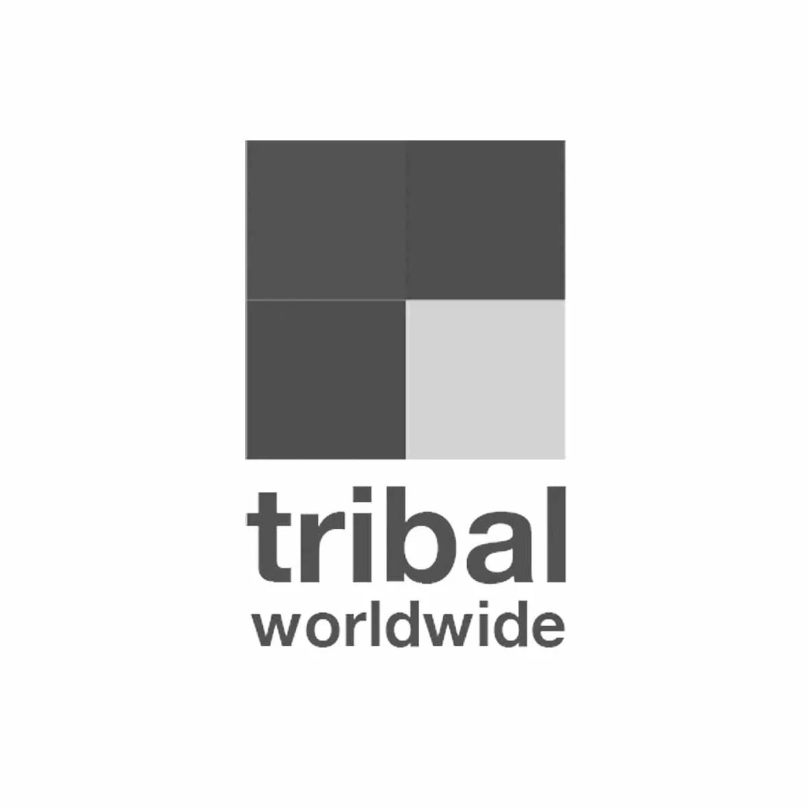 Logo for Tribal Worldwide featuring a four-square grid in varying shades of gray and the text 'tribal worldwide' below in bold black font.