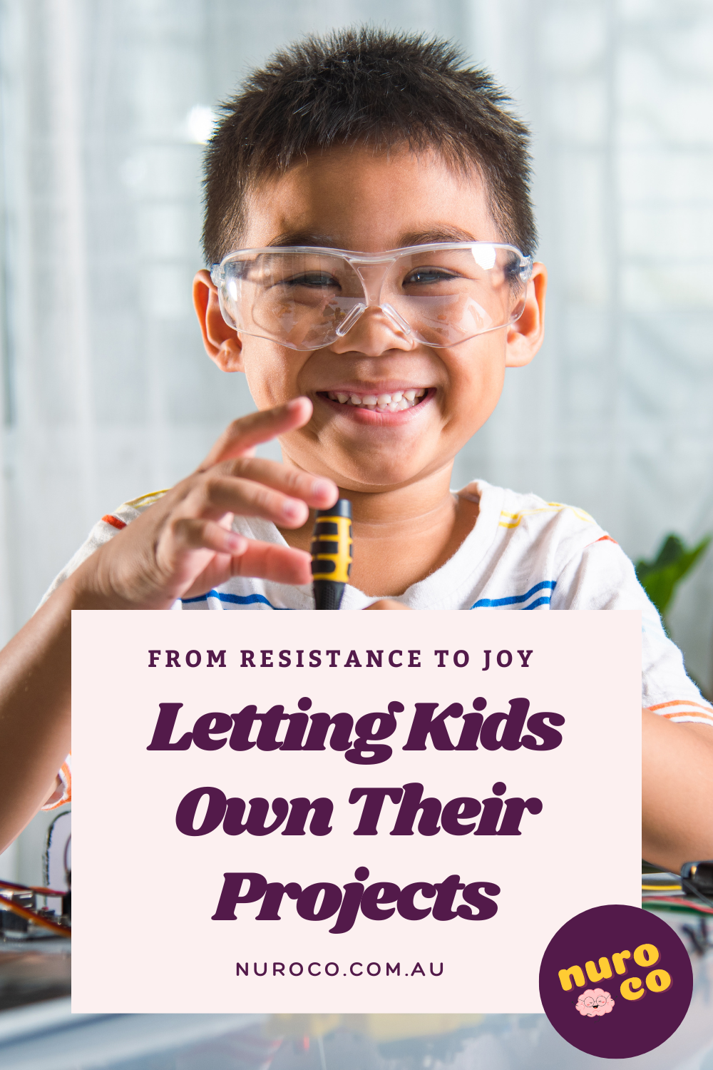 a beaming child works on a project of their choice