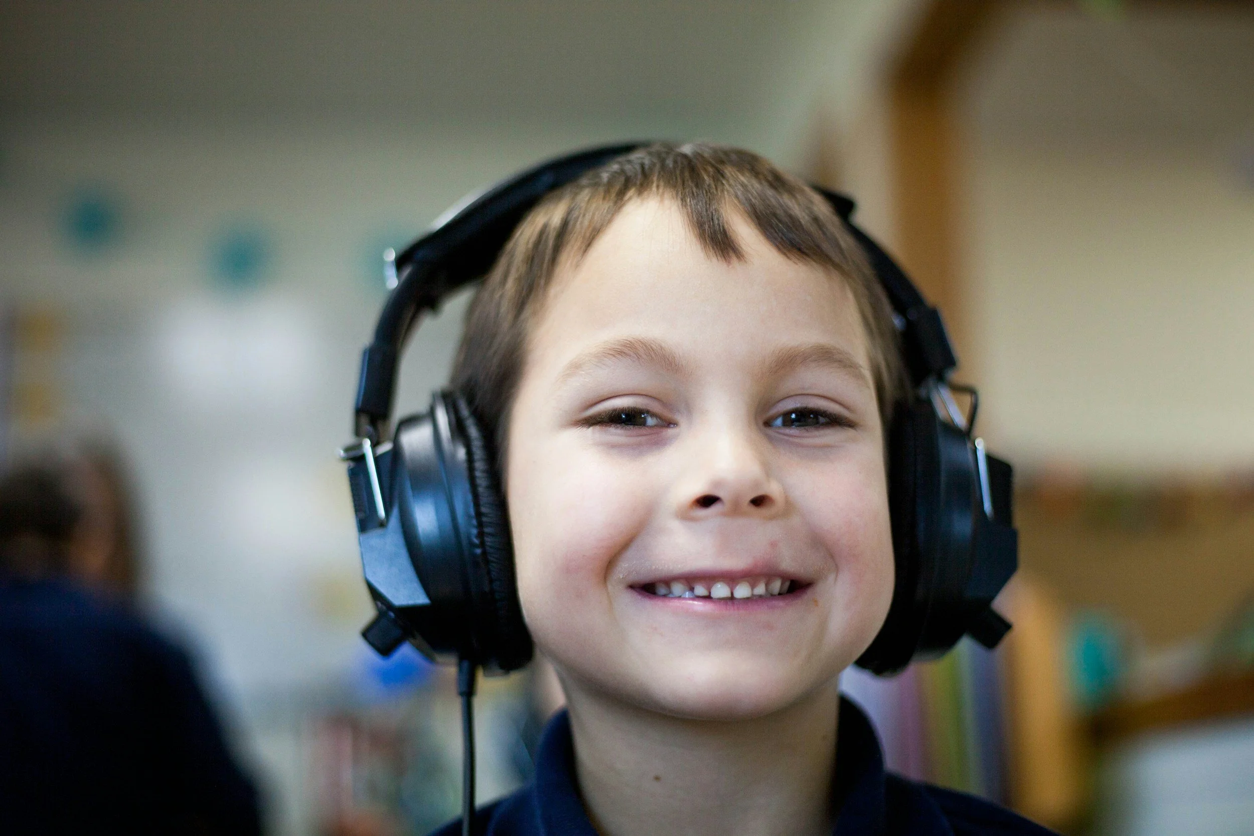 happy kid wearing headphones