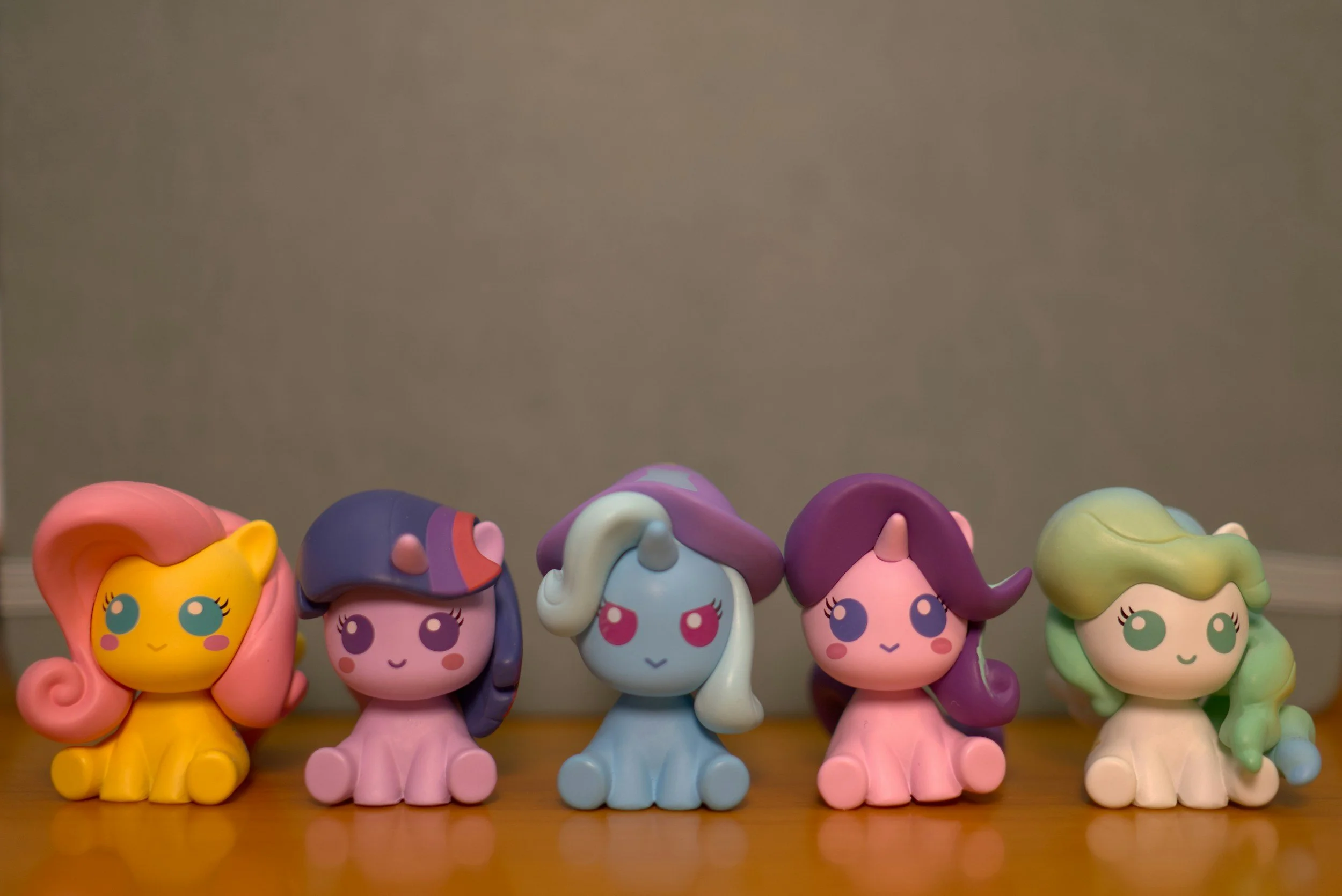a collection of little toy ponies