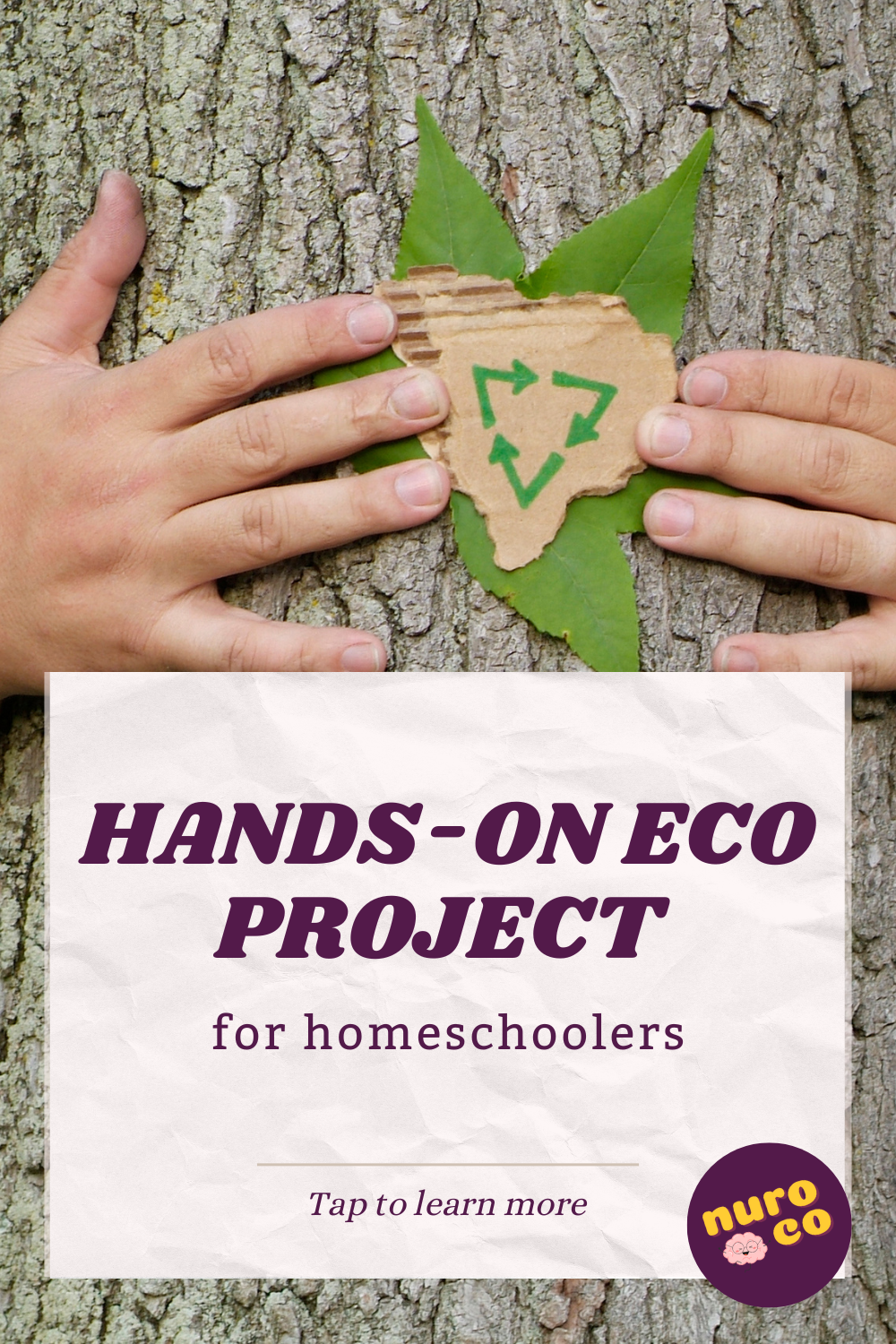 a child's hands on the bark of a tree, holding a recycling symbol on cardboard