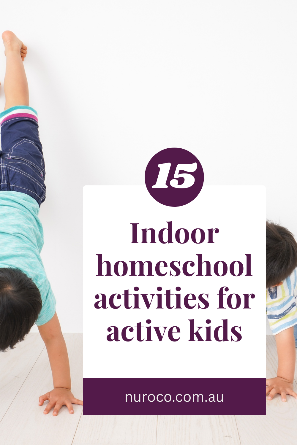 2 kids doing handstands against the wall