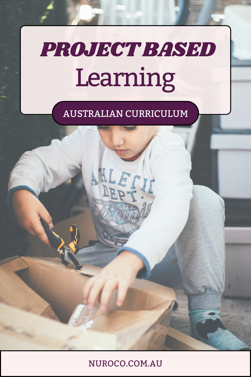 a child makes something out of a cardboard box