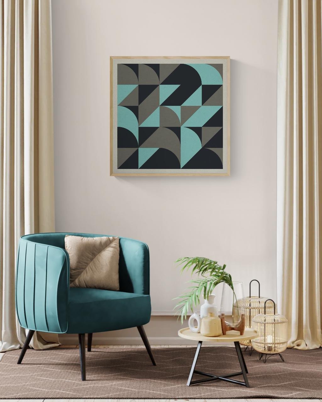 Modern living room corner with a teal armchair, beige pillow, round beige side table with decorative vases and plants, framed geometric art on white wall, beige curtains, and woven lanterns on floor.