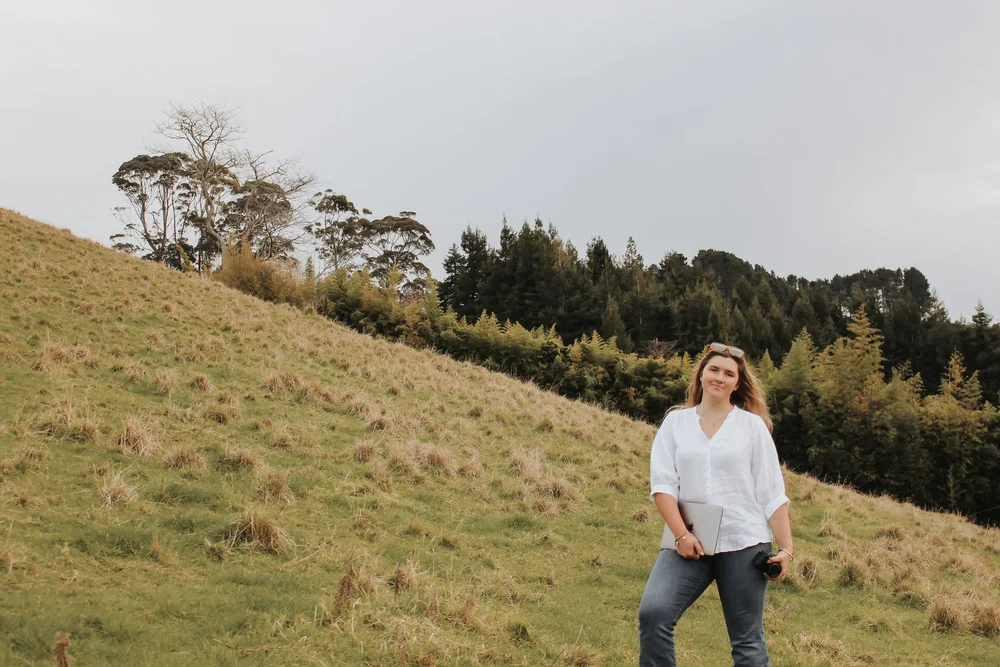 Rosie from Lasso and Lead in the field with her camera