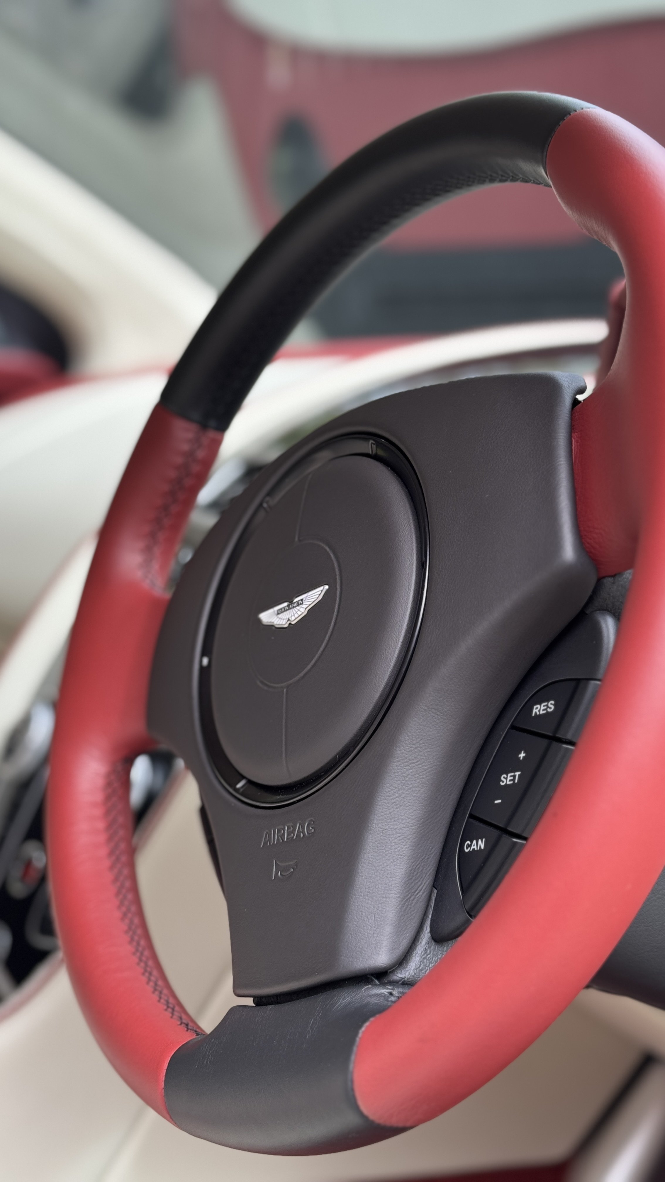 Aston-Martin-DB9-GT-Steering-Wheel-Detail-Two-Tone-Leather-Finish.jpeg