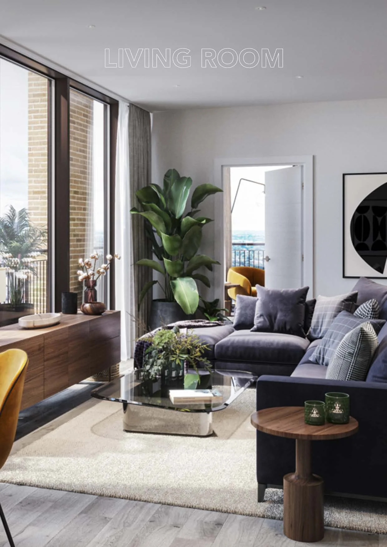 Living room with a large gray sectional sofa, glass coffee table, potted plants, a side table with candles, and large windows with sheer curtains.
