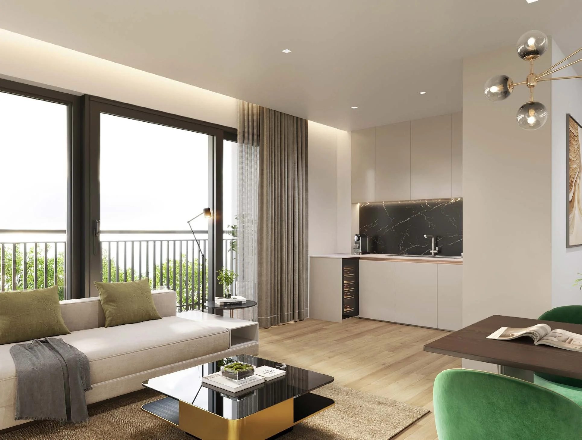 Modern living room with large windows, beige sofa with green pillows, black and gold coffee table, small side table with lamp and plant, kitchen area with black marble backsplash, dining table with green chairs, and wood flooring.