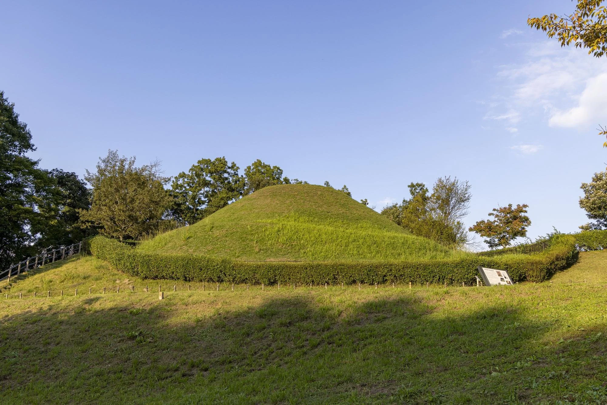 The grass-covered burial mound of Takamatsuzuka Kofun in Asuka Village, Nara.