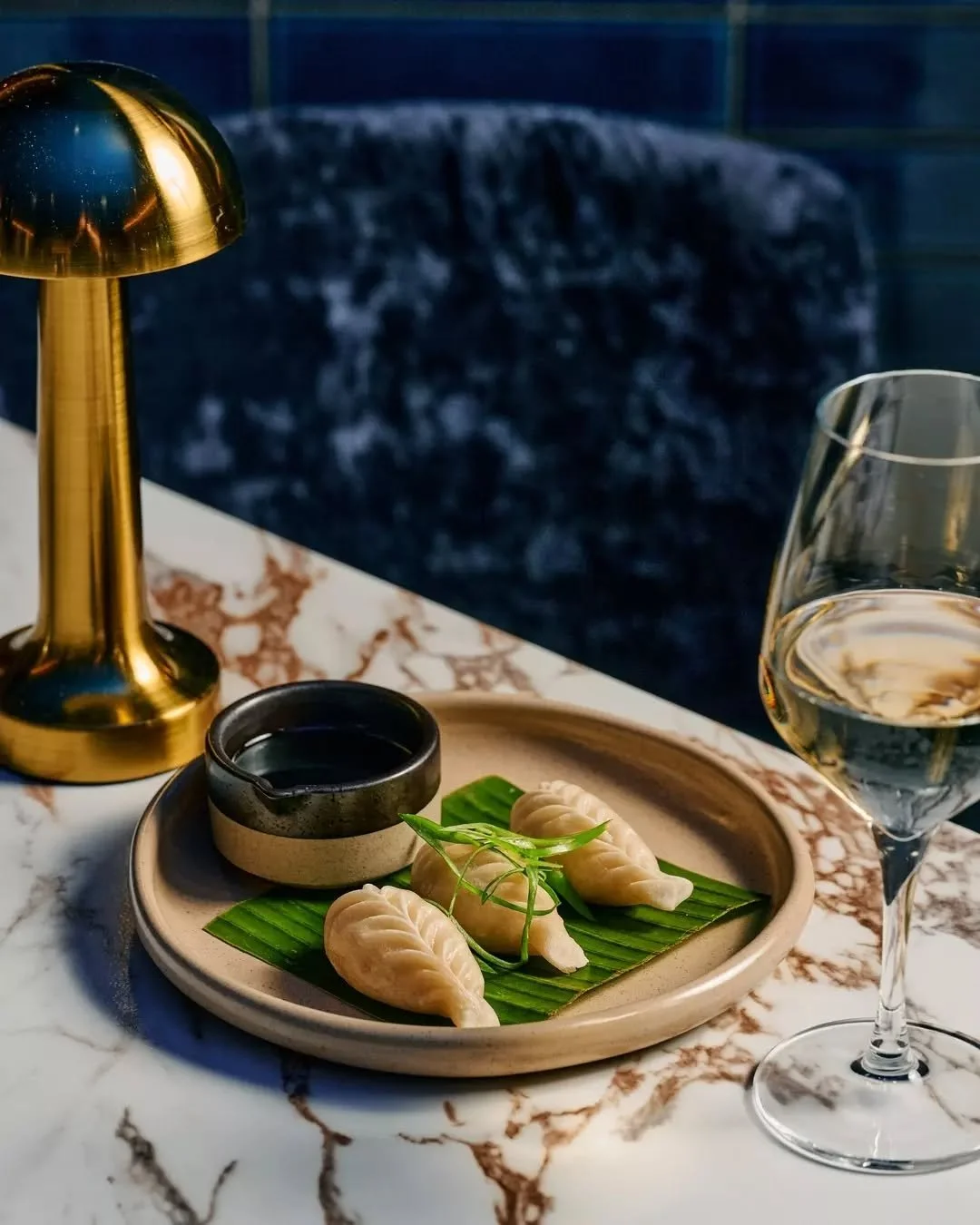 Found: Your new afternoon ritual. Dumplings, chilled wine, and zero plans to leave. &mdash; Fern
