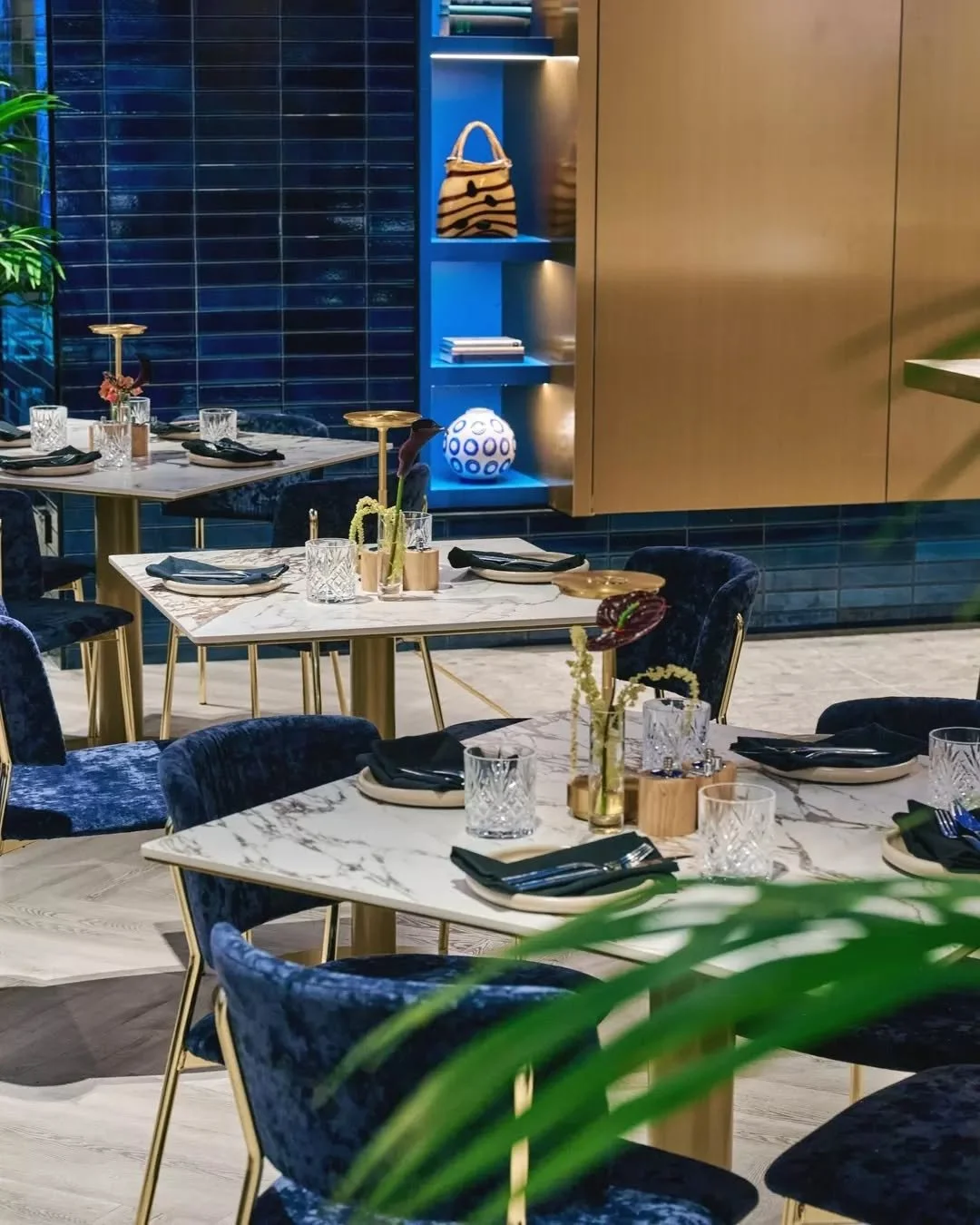 Bold and inviting. The perfect backdrop for long conversations, clinking glasses, and a menu that celebrates the city.